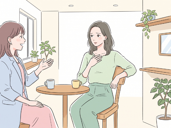 友人と話していて違和感を感じている女性