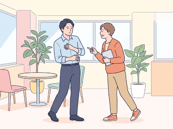 オフィスで同僚に声をかけられて体をそらして嫌悪感のある男性